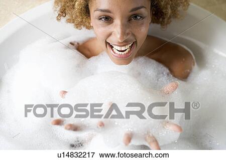 Portrait of a young woman in a bath View Large Photo Image Stock Photo - Portrait of a young woman in a bath. Fotosearch