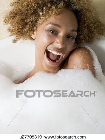 Portrait of a young woman in a bath View Large Photo Image Stock Photo - Portrait of a young woman in a bath. Fotosearch