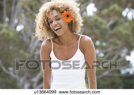 Portrait of a young woman View Large Photo Image Stock Photo - Portrait of a young woman. Fotosearch