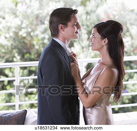 Picture - A couple dressed for an evening out. Fotosearch