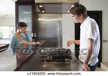 A young couple at home View Large Photo Image Stock Photography - A young couple at home. Fotosearch