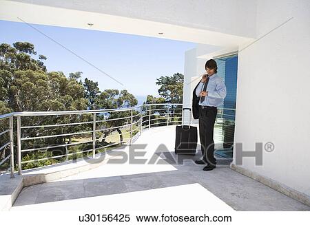 A businessman waiting for a lift View Large Photo Image Stock Photography - A businessman waiting for a lift. Fotosearch