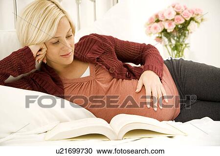 A pregnant woman relaxing View Large Photo Image Stock Image - A pregnant woman relaxing. Fotosearch