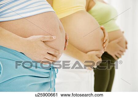 Stock Image - Three pregnant women. Fotosearch