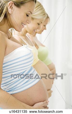 Stock Photography - Three pregnant women. Fotosearch