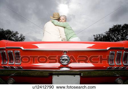 A senior couple in a sports car View Large Photo Image Stock Image - A senior couple in a sports car. Fotosearch