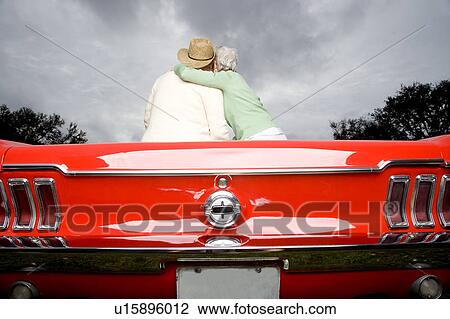 A senior couple in a sports car View Large Photo Image Stock Image - A senior couple in a sports car. Fotosearch
