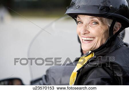 A senior couple on a motorbike View Large Photo Image Stock Image - A senior couple on a motorbike. Fotosearch