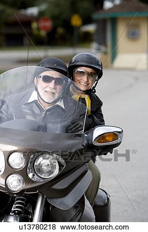 A senior couple on a motorbike View Large Photo Image Stock Photo - A senior couple on a motorbike. Fotosearch