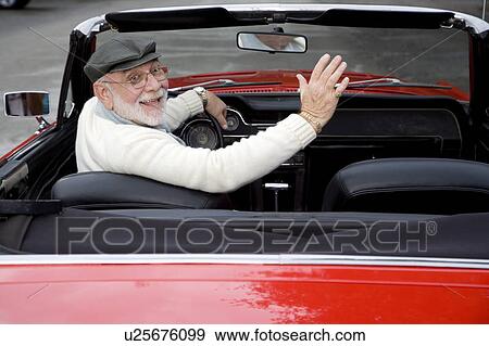 A senior man driving a sports car View Large Photo Image Stock Photo - A senior man driving a sports car. Fotosearch