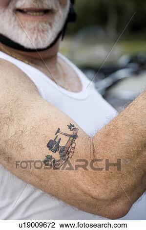 Stock Image - A senior man with tattoos. Fotosearch