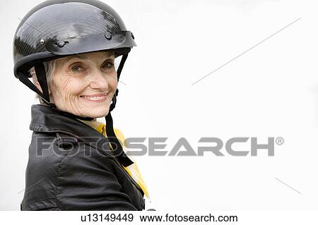 A senior woman wearing a helmet View Large Photo Image Stock Photo - A senior woman wearing a helmet. Fotosearch