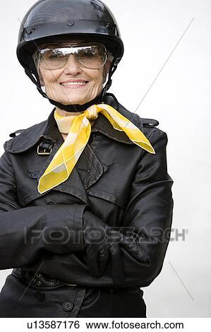 A senior woman wearing a helmet View Large Photo Image Stock Photograph - A senior woman wearing a helmet. Fotosearch
