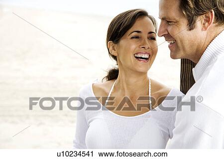 A couple on a beach View Large Photo Image Stock Image - A couple on a beach. Fotosearch