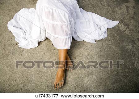 Stock Photo - A woman on a beach. Fotosearch