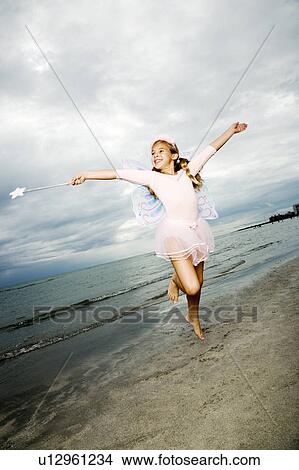 A young girl wearing a fairy costume View Large Photo Image Picture - A young girl wearing a fairy costume. Fotosearch