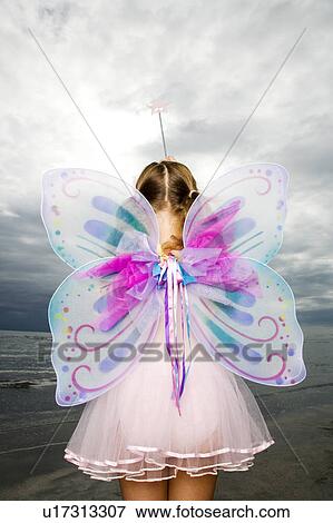 A young girl wearing a fairy costume View Large Photo Image Stock Photo - A young girl wearing a fairy costume. Fotosearch