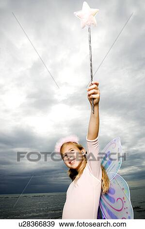 Stock Photo - A young girl wearing a fairy costume. Fotosearch