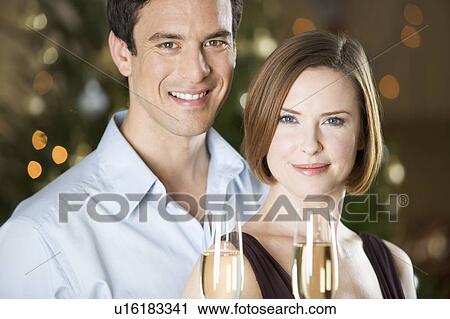 A couple drinking champagne View Large Photo Image Stock Image - A couple drinking champagne. Fotosearch