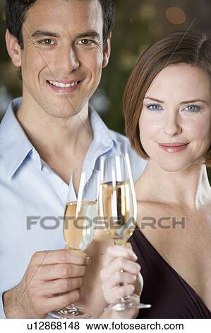 Stock Photo - A couple drinking champagne. Fotosearch