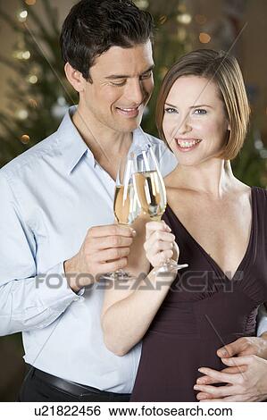 A couple drinking champagne View Large Photo Image Stock Photograph - A couple drinking champagne. Fotosearch