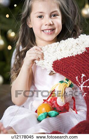 A young girl with a Christmas stocking View Large Photo Image Stock Photography - A young girl with a Christmas stocking. Fotosearch