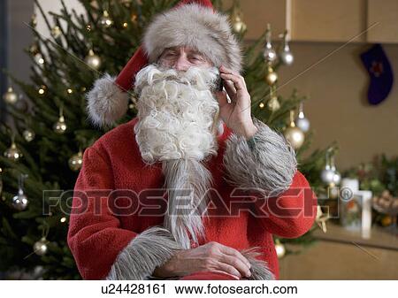 Father christmas / santa Claus talking on a mobile phone View Large Photo Image Stock Image - Father christmas / santa Claus talking on a mobile phone. Fotosearch
