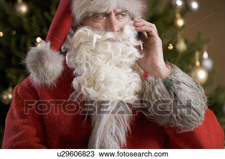 Father christmas / santa Claus talking on a mobile phone View Large Photo Image Stock Image - Father christmas / santa Claus talking on a mobile phone. Fotosearch