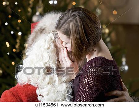 Mummy kissing Santa Claus View Large Photo Image Stock Image - Mummy kissing Santa Claus. Fotosearch