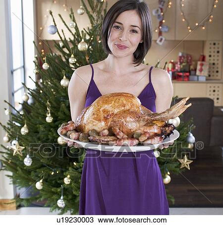 A mother with the Christmas turkey View Large Photo Image Stock Image - A mother with the Christmas turkey. Fotosearch