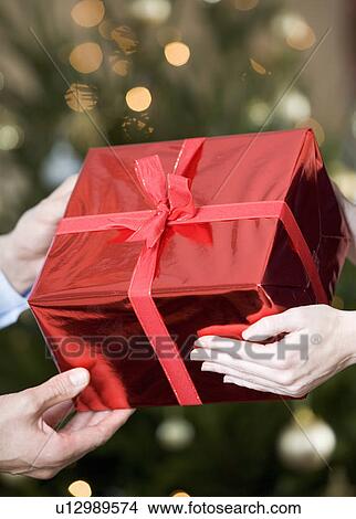 Picture - A present being exchanged. Fotosearch