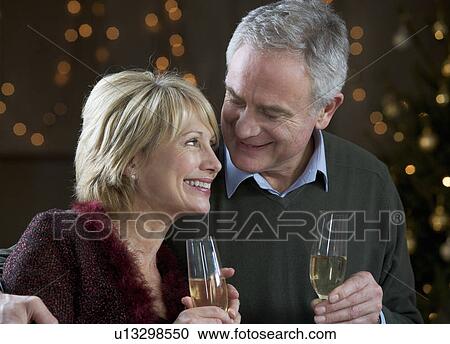 A senior couple drinking champagne View Large Photo Image Stock Image - A senior couple drinking champagne. Fotosearch