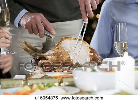 Carving the Christmas turkey View Large Photo Image Stock Photography - Carving the Christmas turkey. Fotosearch