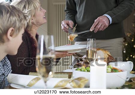 Dishing up the Christmas turkey View Large Photo Image Stock Image - Dishing up the Christmas turkey. Fotosearch