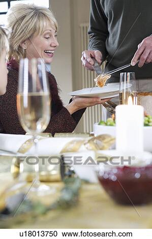 Dishing up the Christmas turkey View Large Photo Image Stock Image - Dishing up the Christmas turkey. Fotosearch