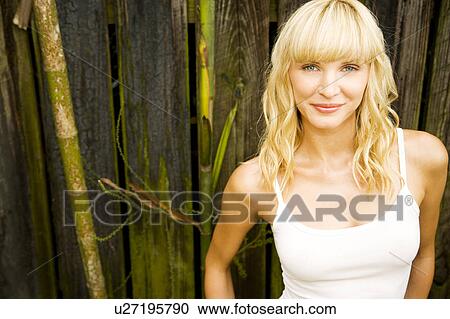 Stock Image - Beauty portrait of a woman in a tropical setting.. Fotosearch
