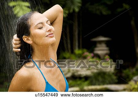 Beauty portrait of a woman in a tropical shower setting. View Large Photo Image Stock Photo - Beauty portrait of a woman in a tropical shower setting.. Fotosearch