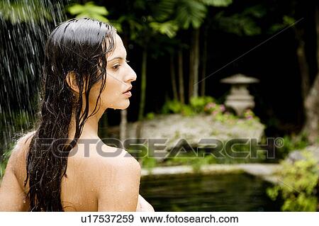 Beauty portrait of a woman in a tropical shower setting. View Large Photo Image Stock Photo - Beauty portrait of a woman in a tropical shower setting.. Fotosearch
