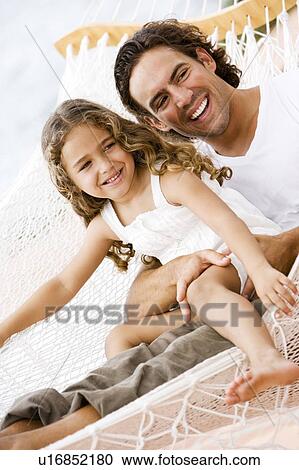 father and daughter sitting in a hammock View Large Photo Image Stock Image - father and daughter sitting in a hammock. Fotosearch