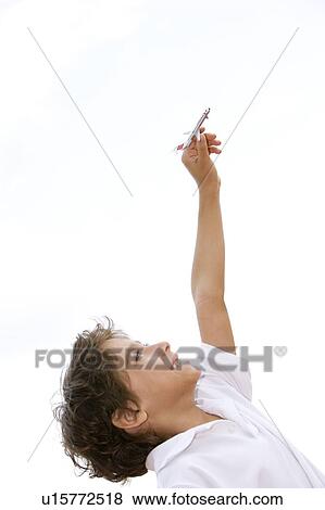 little boy playing with toy aeroplane View Large Photo Image Stock Photo - little boy playing with toy aeroplane. Fotosearch