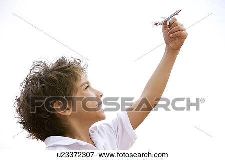 little boy playing with toy aeroplane View Large Photo Image Stock Photo - little boy playing with toy aeroplane. Fotosearch