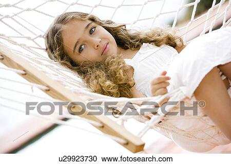 little girl lying in a hammock View Large Photo Image Stock Image - little girl lying in a hammock. Fotosearch