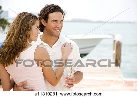 Couple drinking champagne on holiday View Large Photo Image Stock Image - Couple drinking champagne on holiday. Fotosearch