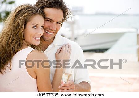 Couple drinking champagne on holiday View Large Photo Image Stock Photography - Couple drinking champagne on holiday. Fotosearch