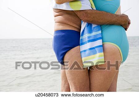 Close up portrait of a senior couple wrapped in a towel at the beach View Large Photo Image Stock Image - Close up portrait of a senior couple wrapped in a towel at the beach. Fotosearch