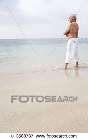 Portrait of a senior man looking out to sea View Large Photo Image Stock Photo - Portrait of a senior man looking out to sea. Fotosearch
