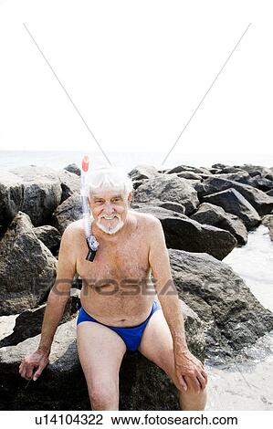 Senior man with snorkel gear at the beach View Large Photo Image Stock Image - Senior man with snorkel gear at the beach . Fotosearch