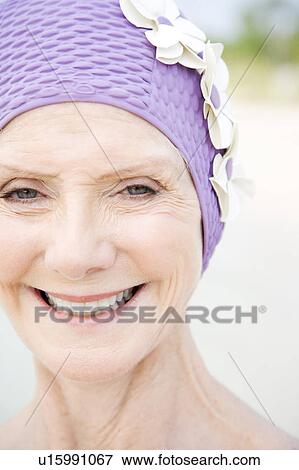 Senior woman in a swimming hat, at the beach View Large Photo Image Stock Photo - Senior woman in a swimming hat, at the beach . Fotosearch