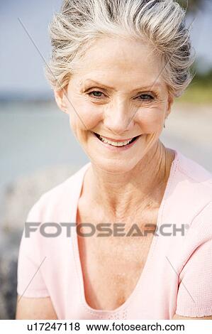 Portrait of a senior woman at the beach View Large Photo Image Stock Photo - Portrait of a senior woman at the beach . Fotosearch