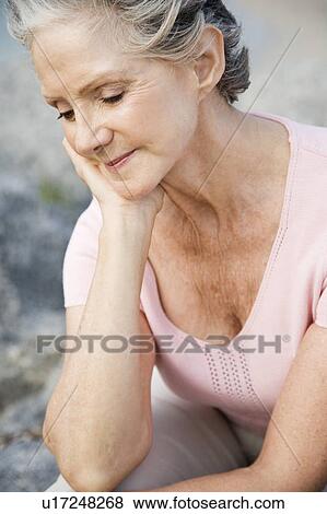 Portrait of a senior woman at the beach View Large Photo Image Stock Photo - Portrait of a senior woman at the beach . Fotosearch